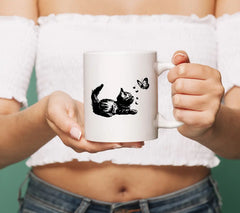 Curious Kitten Playing With Butterfly