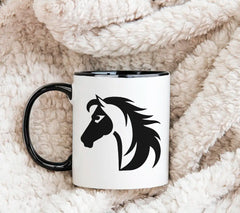 A Black And White Horse With A Black Mane And Tail